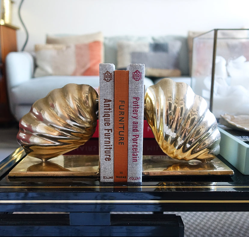 Pair of brass shell bookends