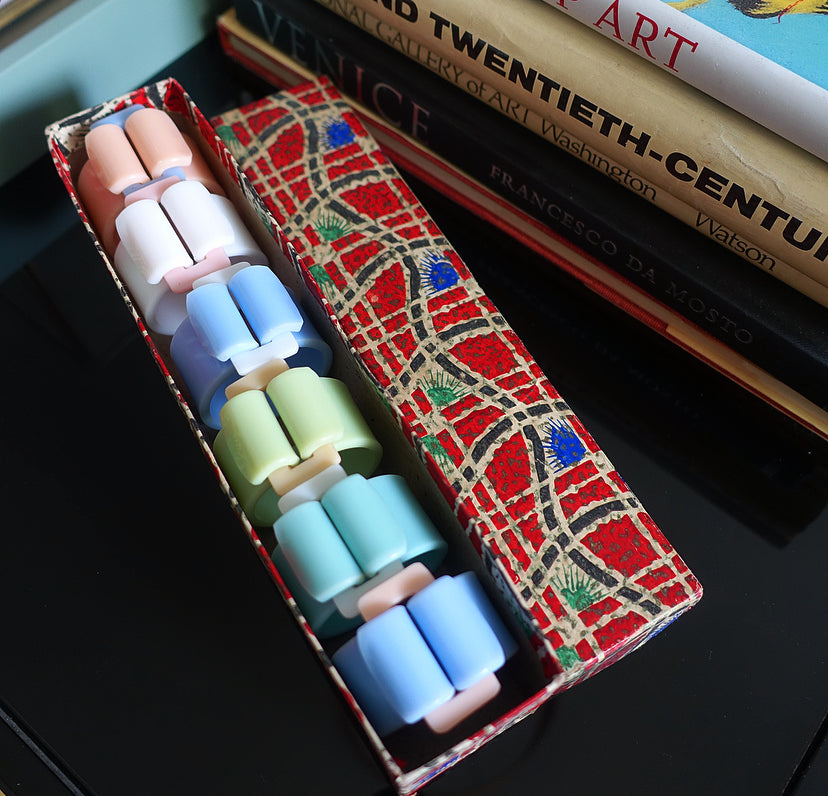 Rare set of six pastel Bakelite buckle napkin rings