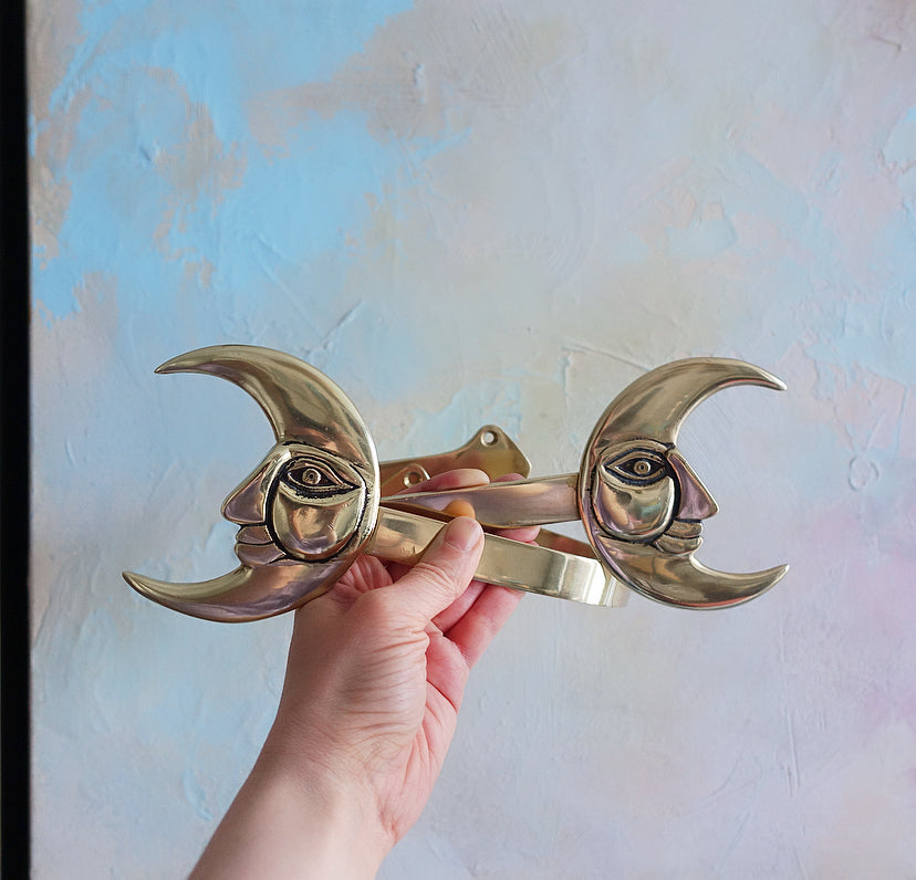 Pair of brass moon curtain tie-backs