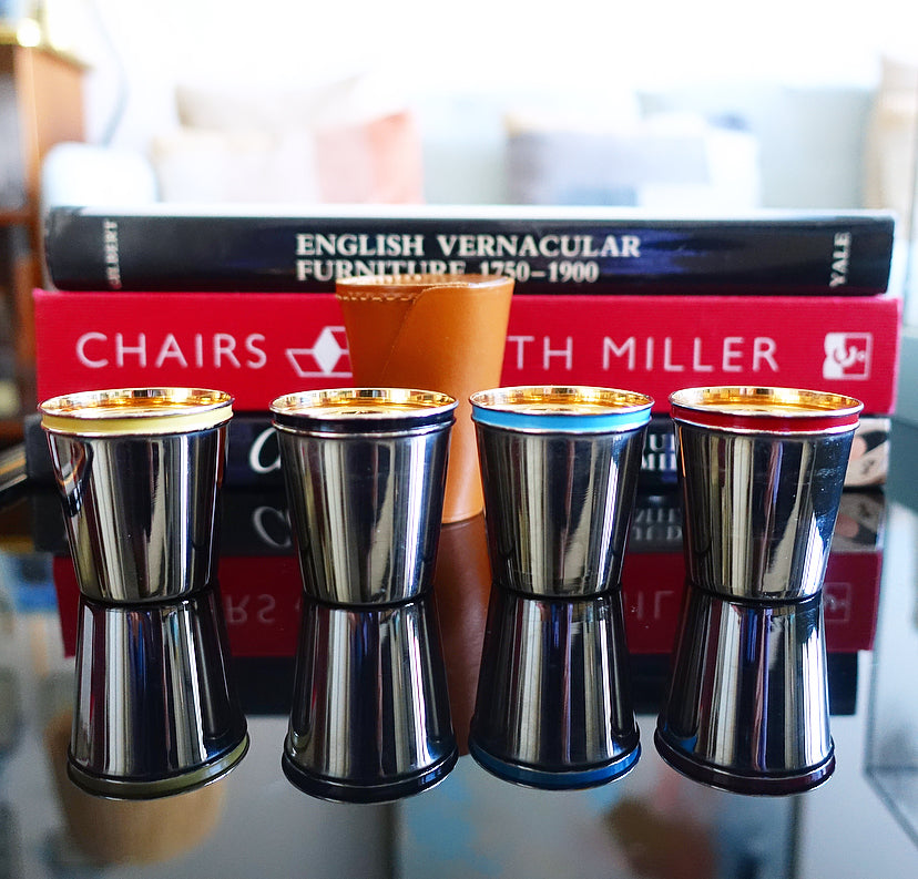 Set of four shot cups in case