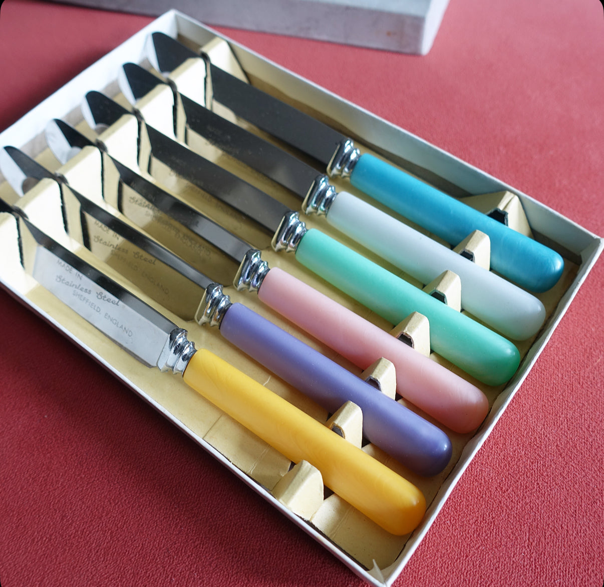 Set of six pastel tea knives
