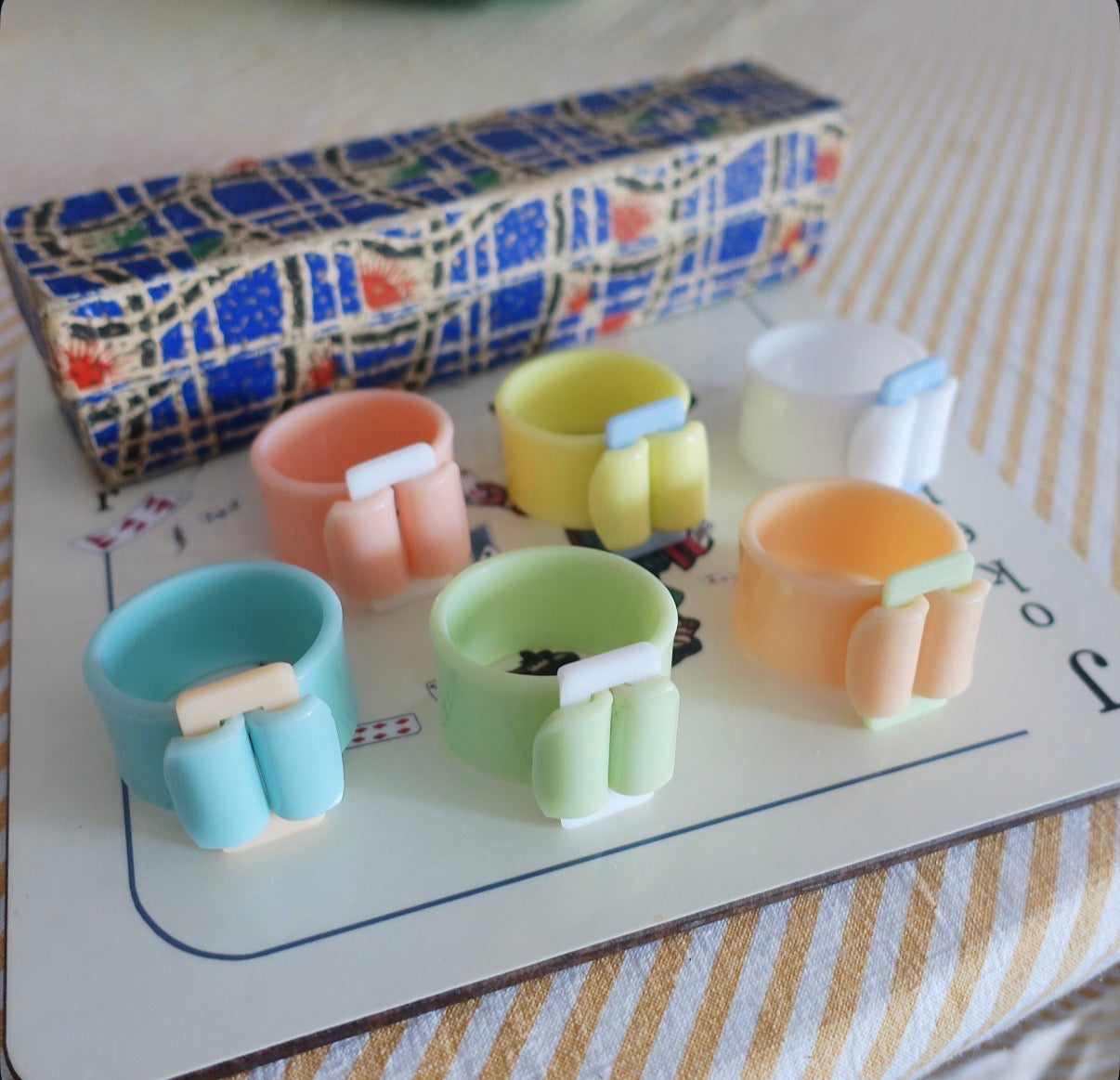 Set of six Pastel Bakelite buckle napkin rings