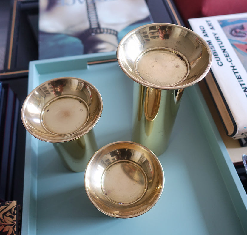 Set of three brass pillar candle holders