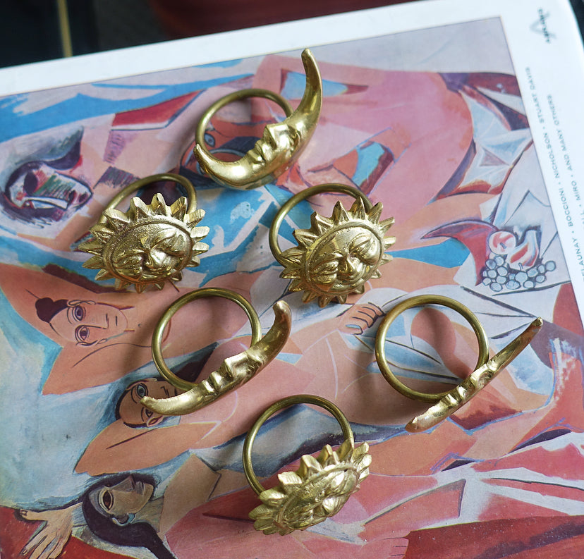 Set of six celestial brass napkin rings