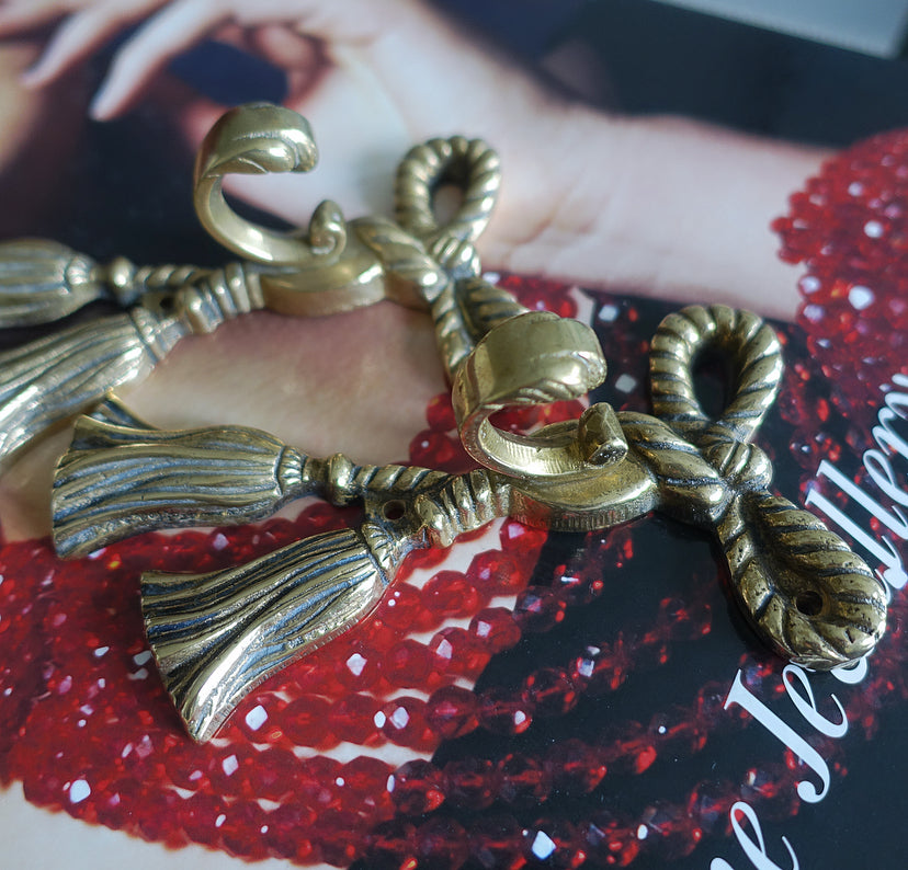 Pair of brass bow hooks