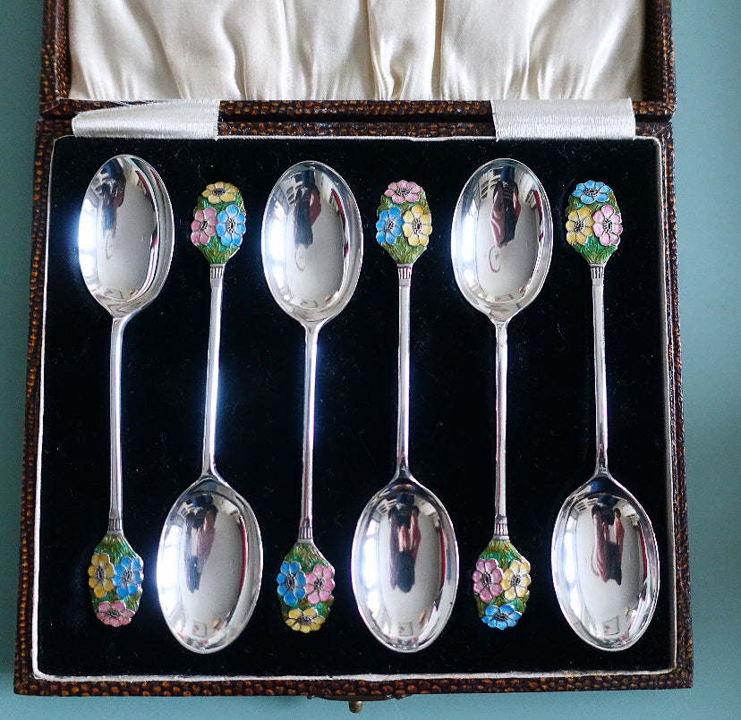 Set of six Art Deco silver hallmarked spoons with enamel floral finials