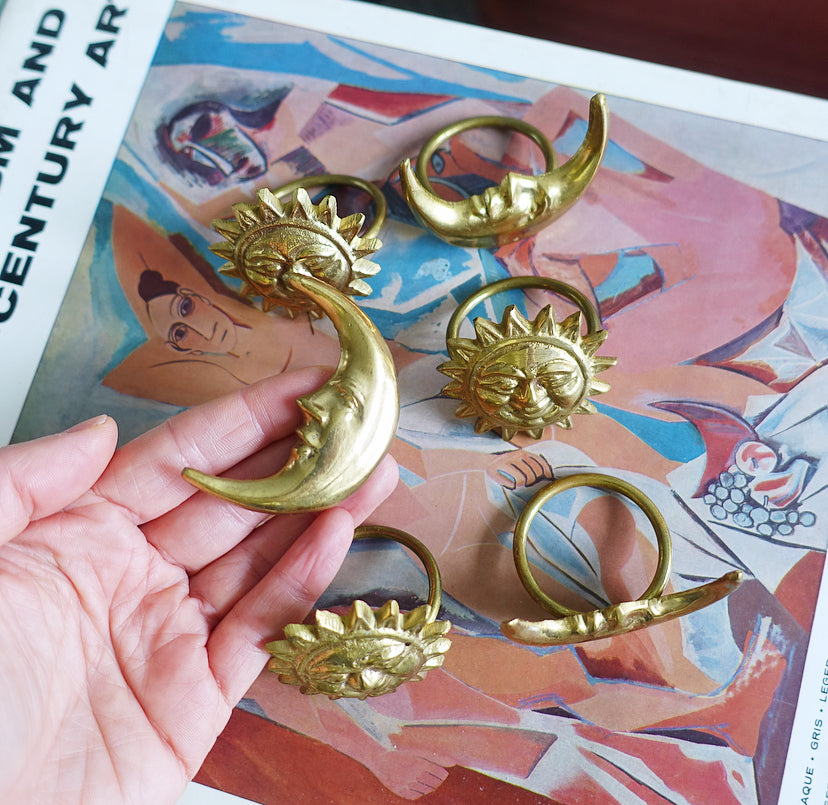 Set of six celestial brass napkin rings
