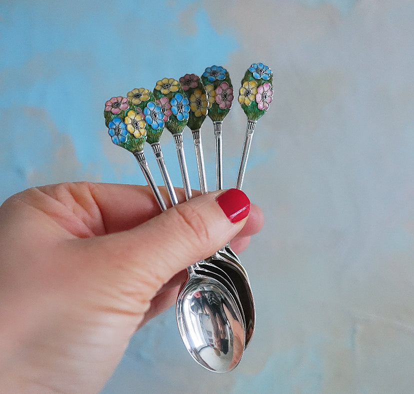 Set of six Art Deco silver hallmarked spoons with enamel floral finials