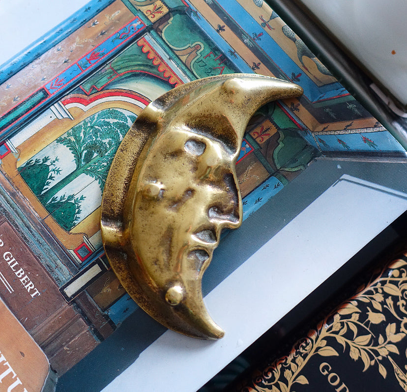 Brass man in the moon ashtray