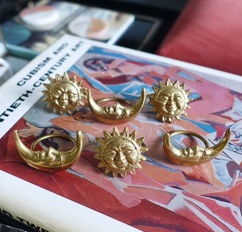 Set of six celestial brass napkin rings