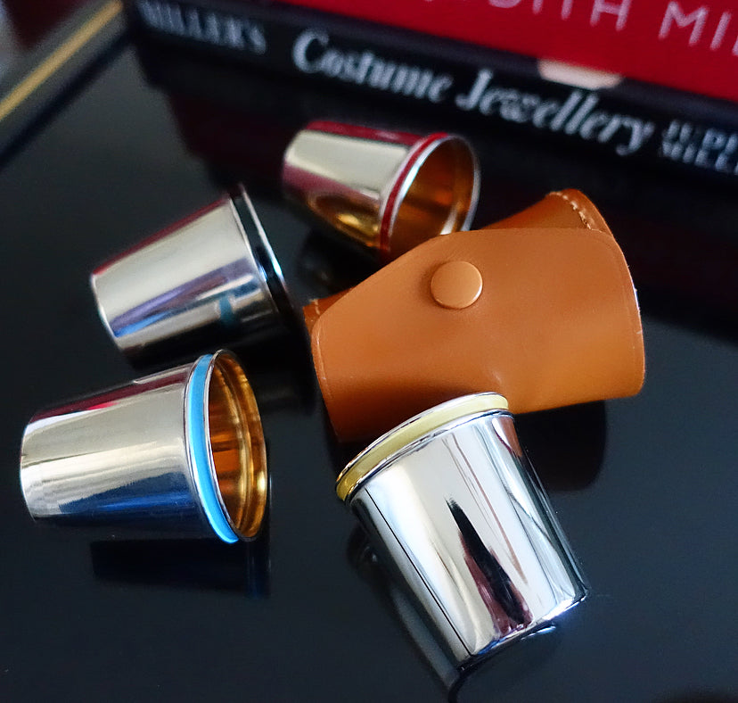 Set of four shot cups in case