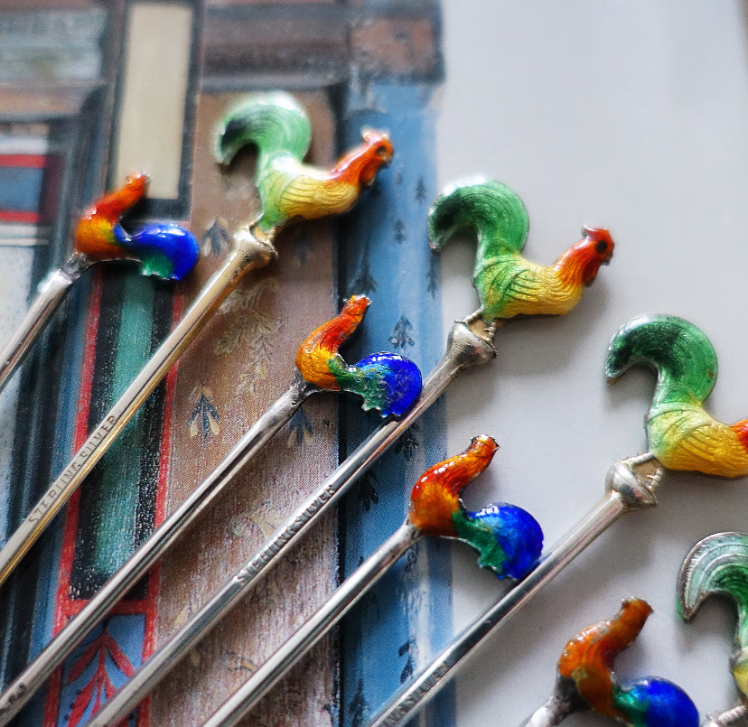Set of 10 assorted silver and enamel cocktail sticks