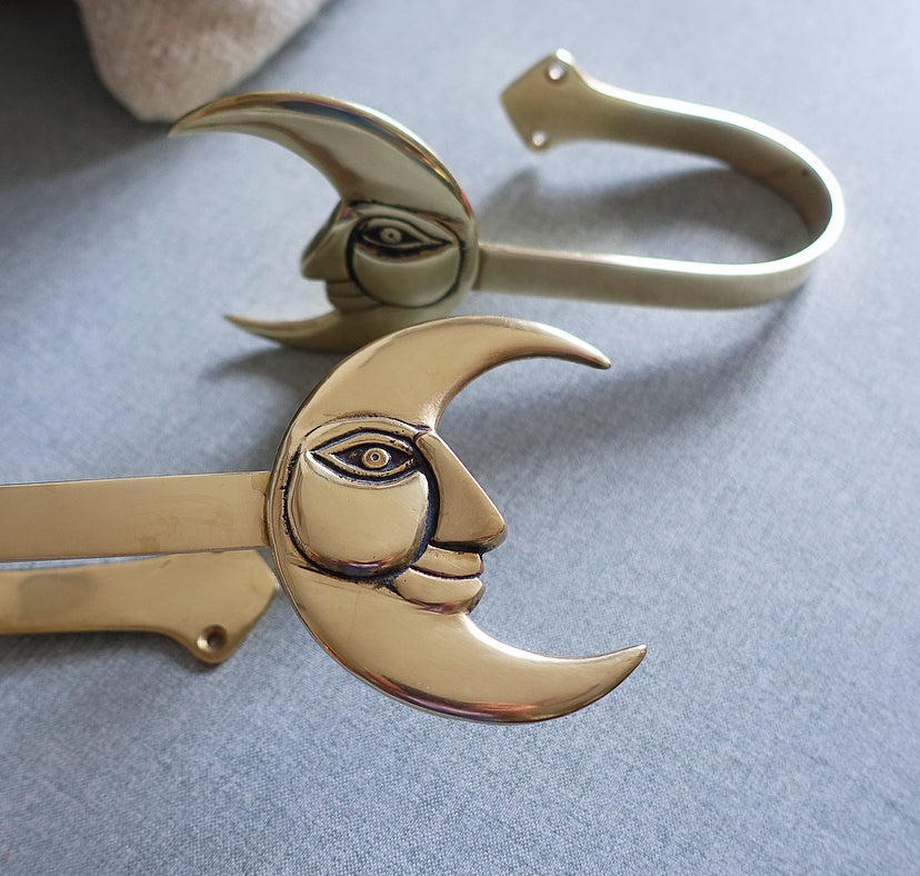 Pair of brass moon curtain tie-backs