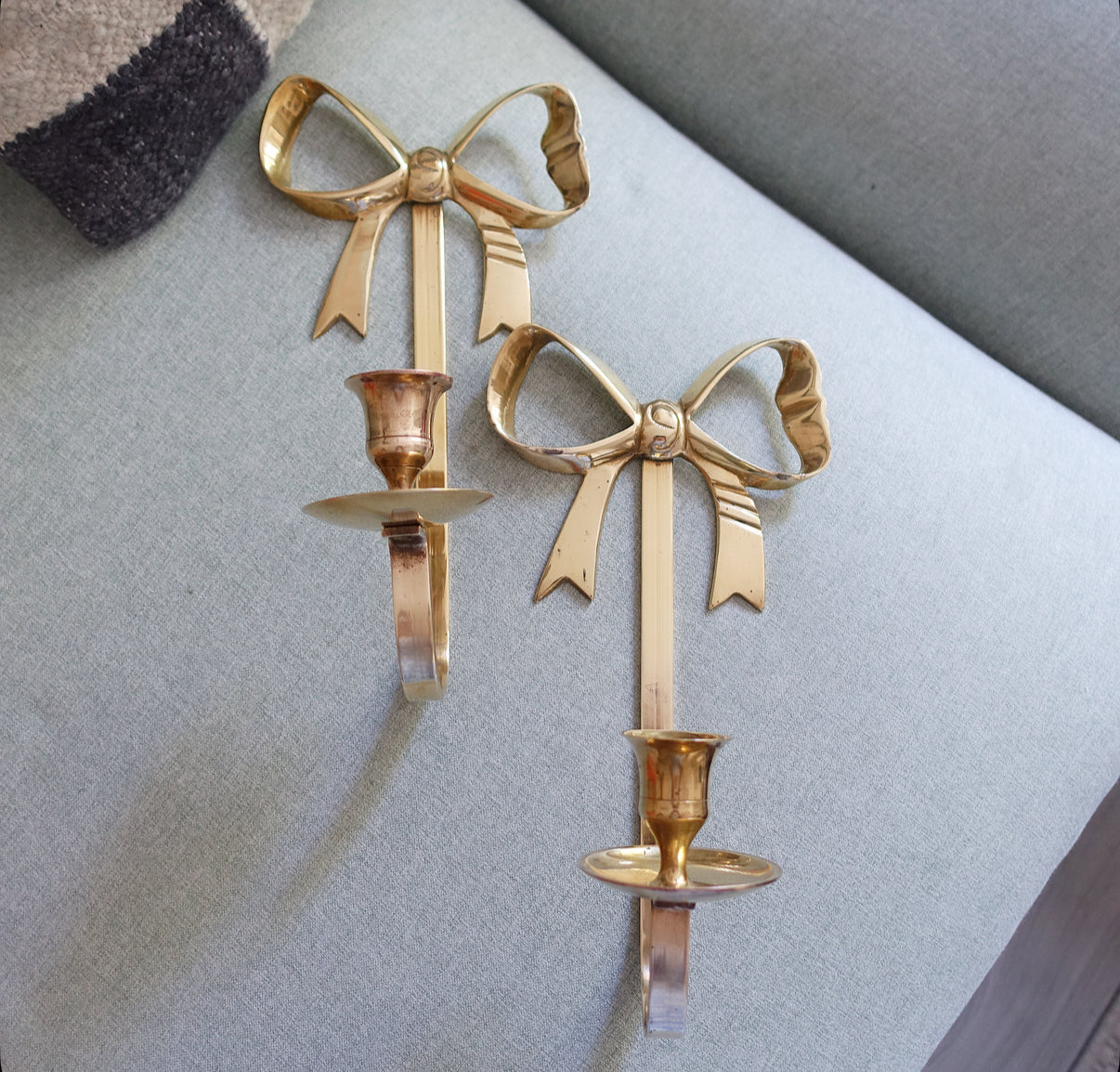 Pair of brass bow candle sconces