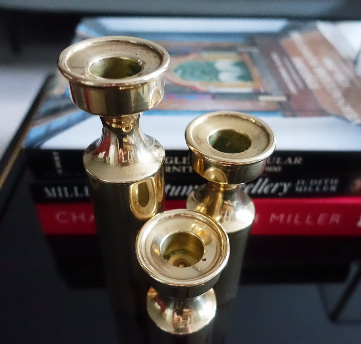Set of three Danish brass candle holders