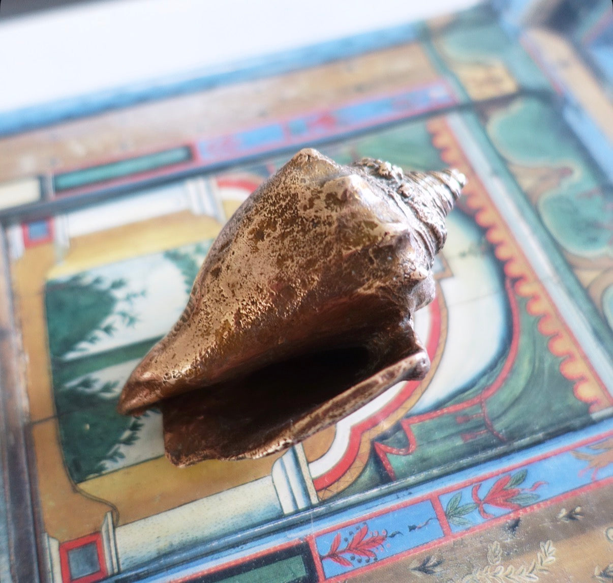 Brass conch shell paperweight
