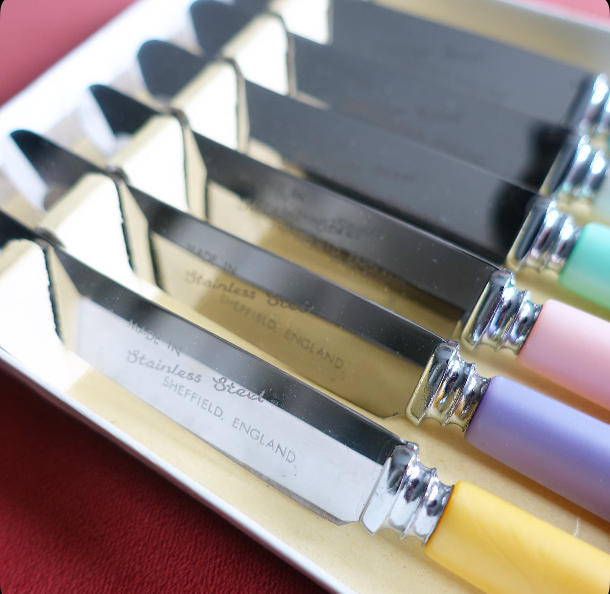 Set of six pastel tea knives