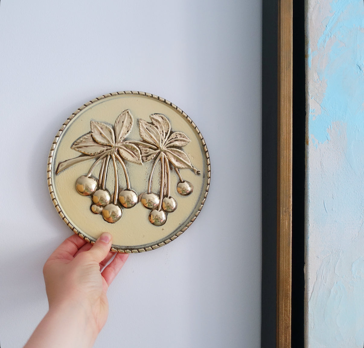Set of four brass fruit wall plaques
