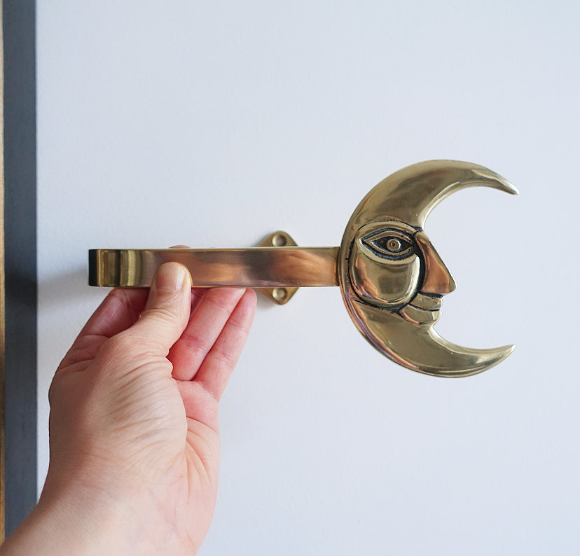 Pair of brass moon curtain tie-backs