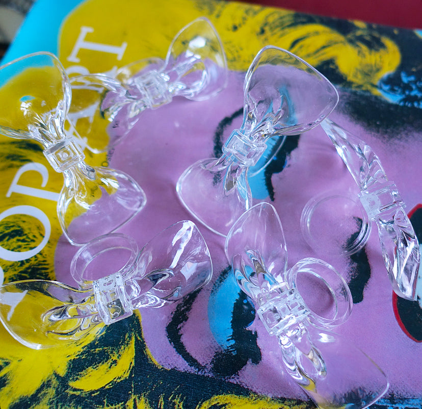 Set of six acrylic bow napkin rings