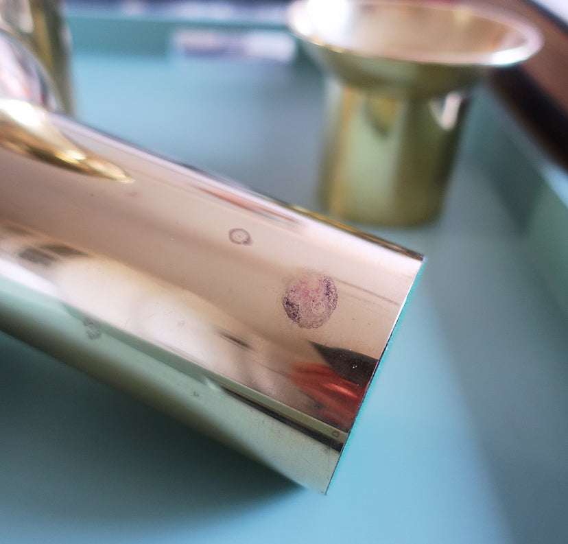 Set of three brass pillar candle holders