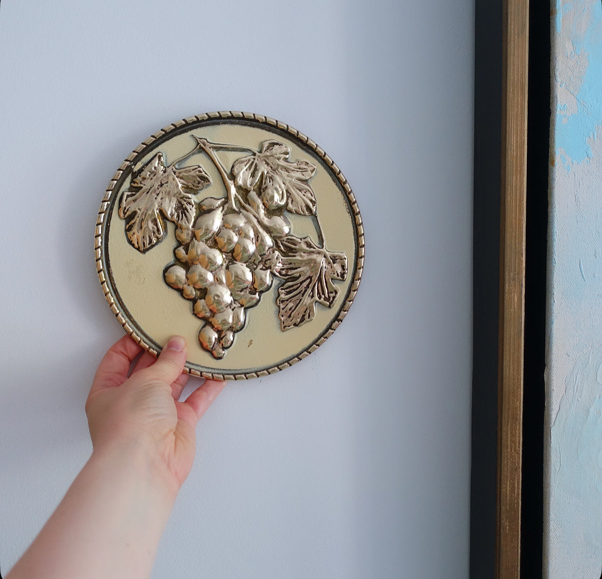 Set of four brass fruit wall plaques