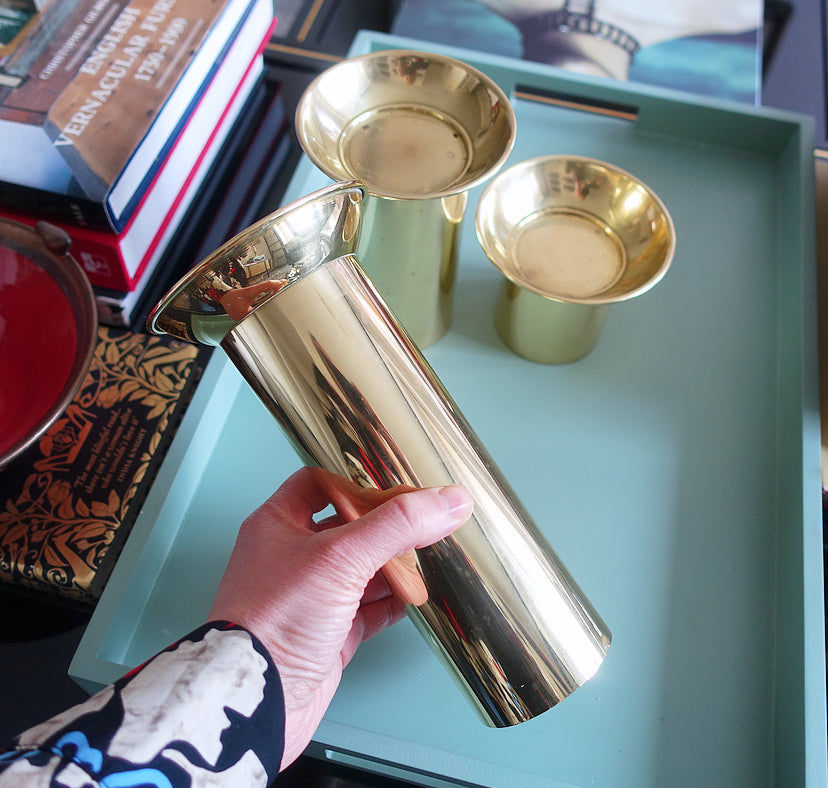 Set of three brass pillar candle holders