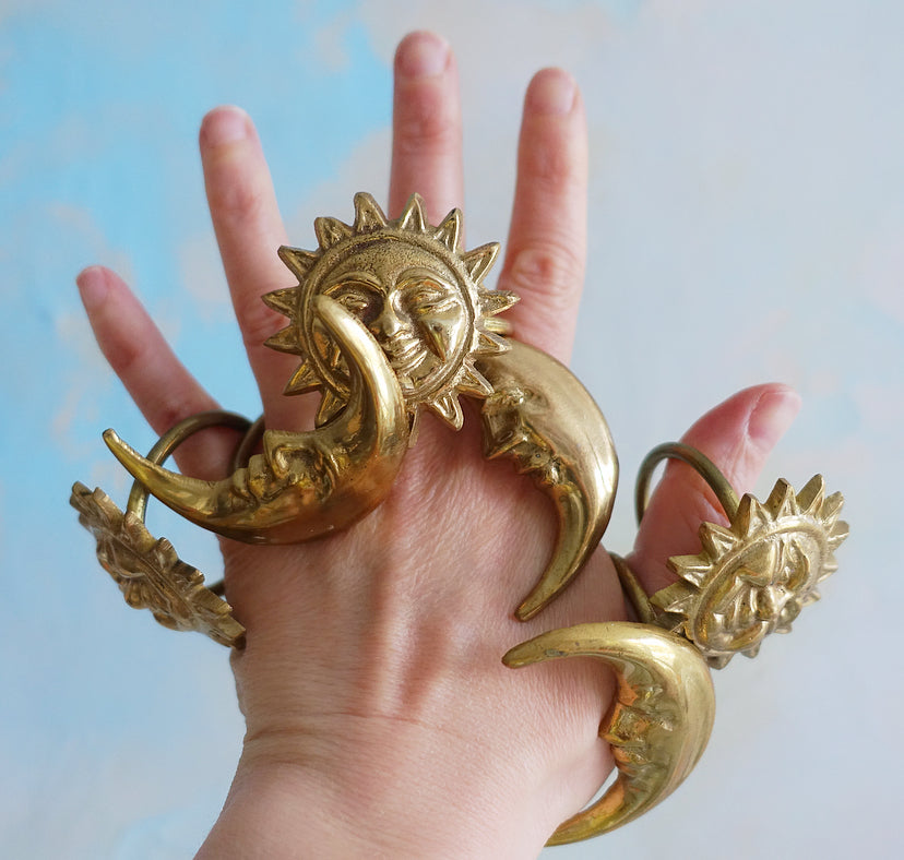 Set of six celestial brass napkin rings
