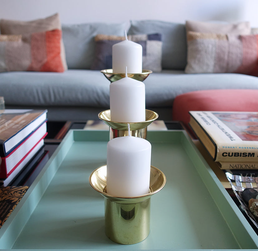 Set of three brass pillar candle holders
