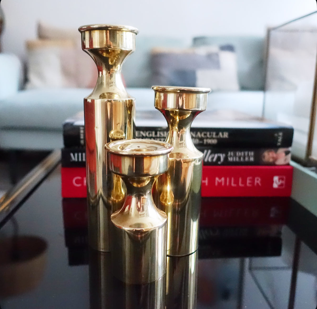 Set of three Danish brass candle holders