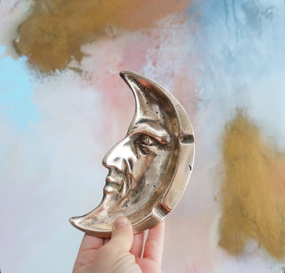 Brass man in the moon ashtray