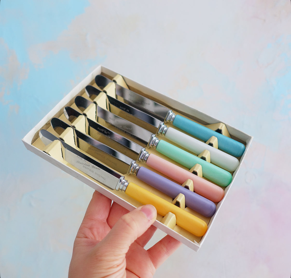 Set of six pastel tea knives