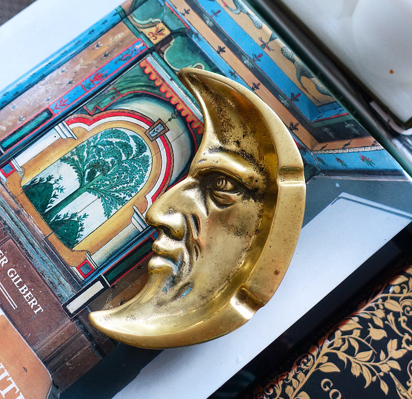 Brass man in the moon ashtray
