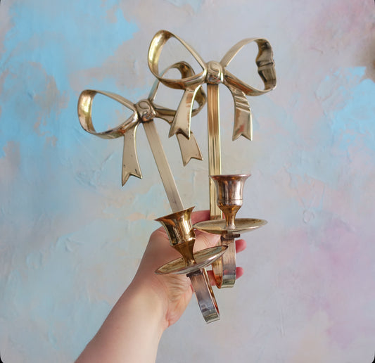 Pair of brass bow candle sconces