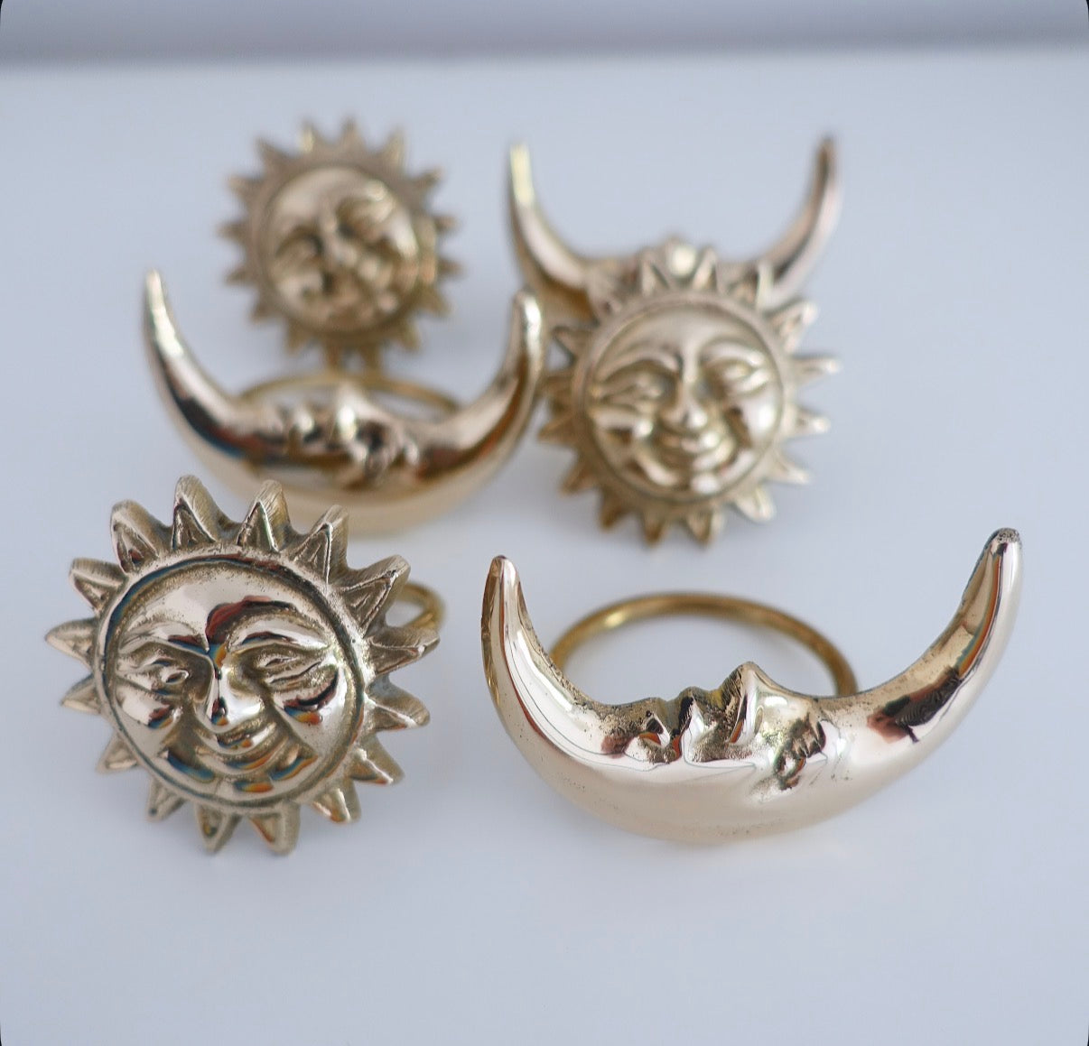 Set of six Celestial brass Sun & moon napkin rings
