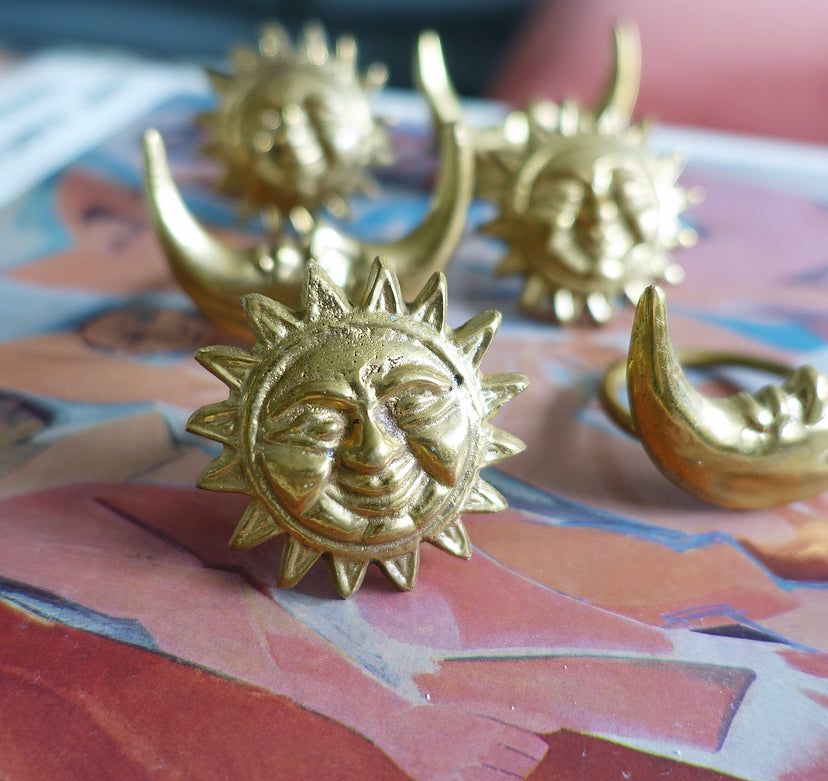 Set of six celestial brass napkin rings