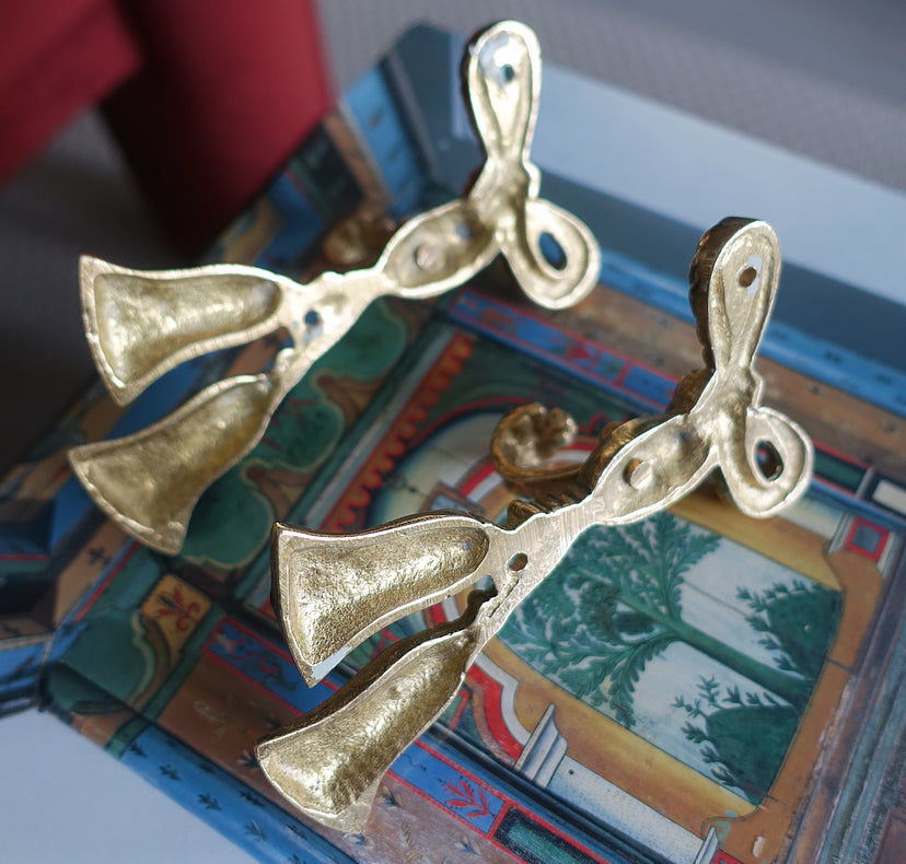 Pair 1: Pair of brass bow hooks