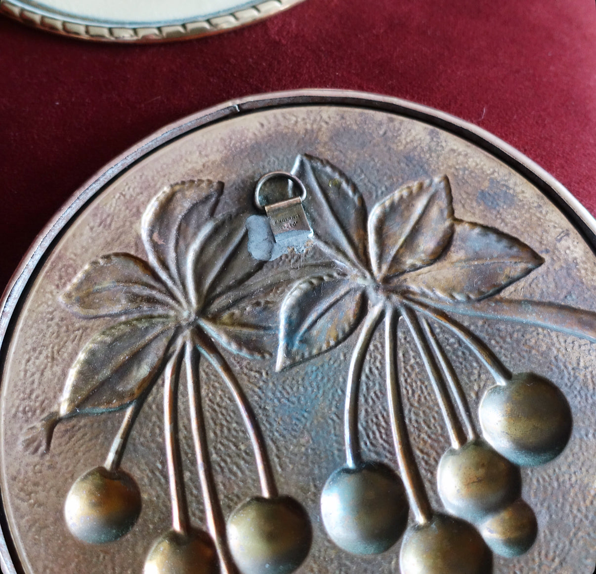 Set of four brass fruit wall plaques