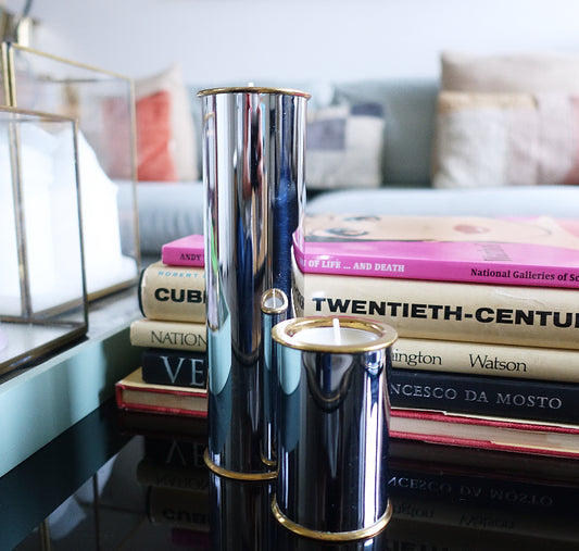 Set of two Swedish chrome and brass candle holders