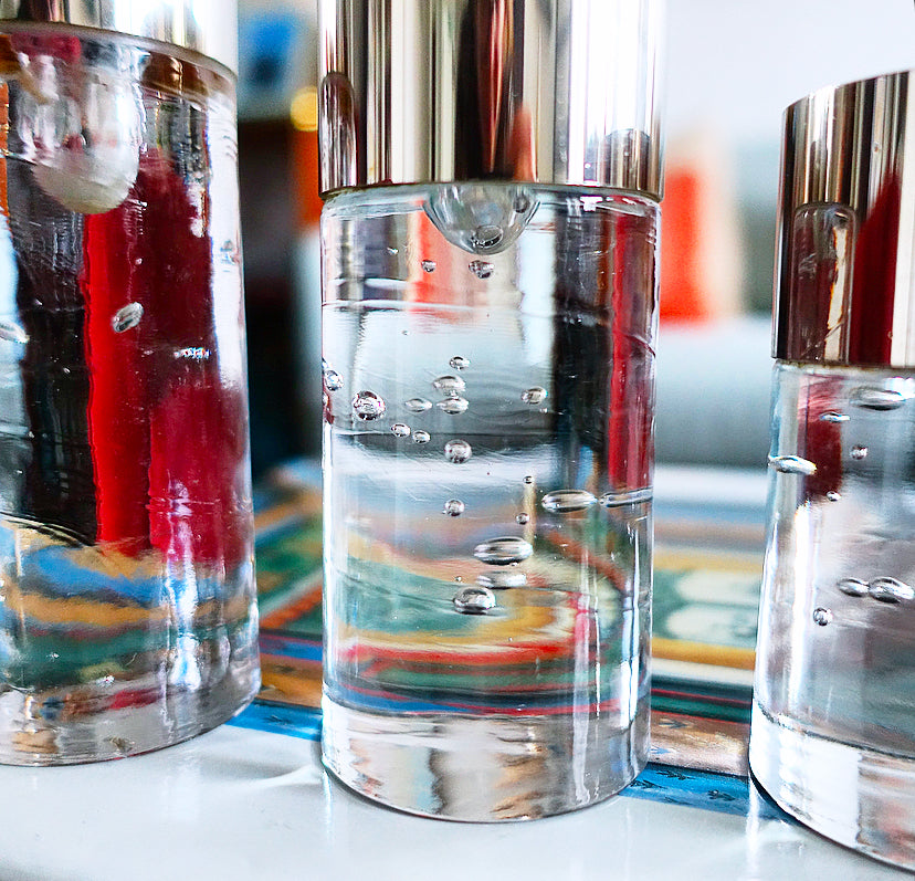 Set of three Swedish controlled bubble glass & brass candle holders