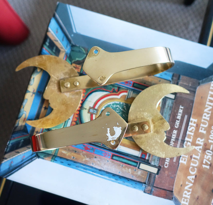 Pair of brass moon curtain tie-backs