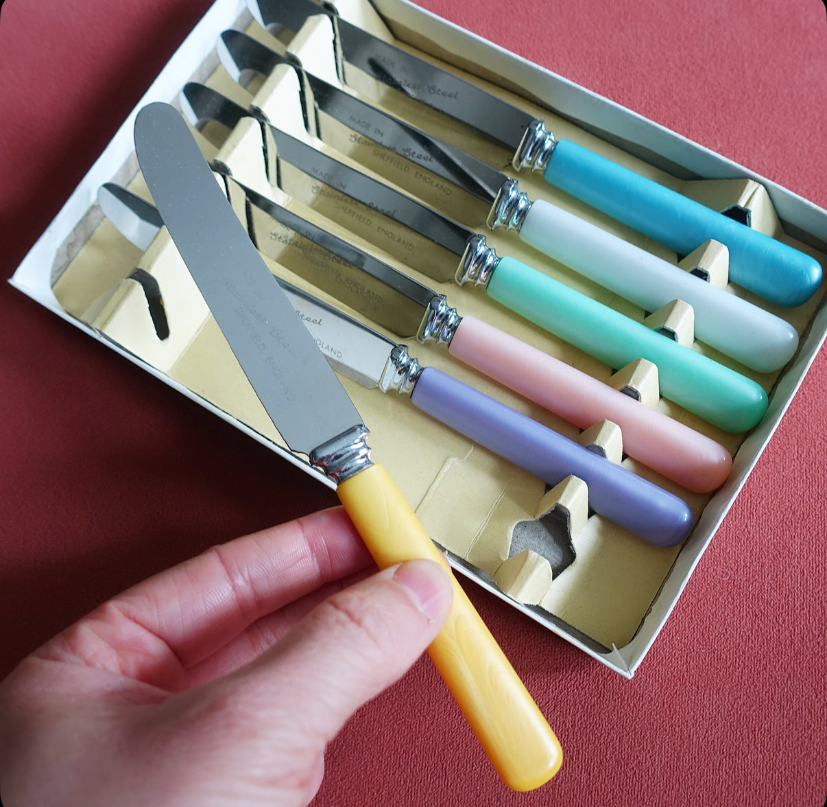 Set of six pastel tea knives