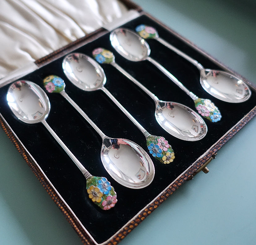 Set of six Art Deco silver hallmarked spoons with enamel floral finials