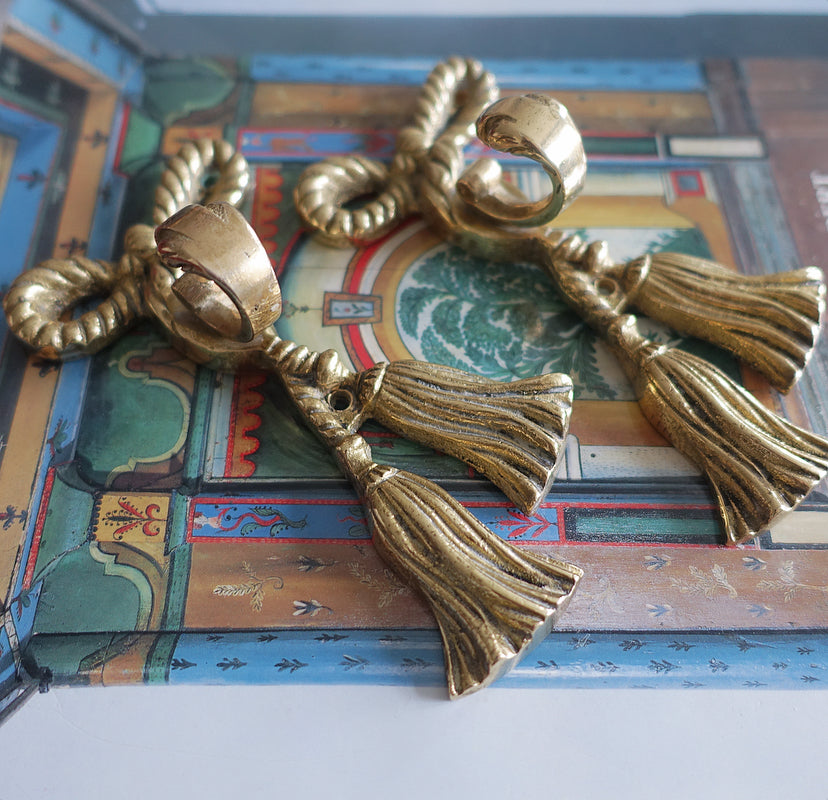 Pair 1: Pair of brass bow hooks