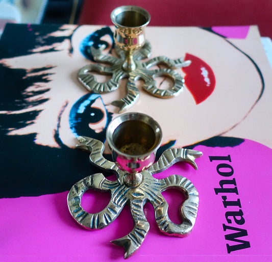 Pair of brass bow candle holders