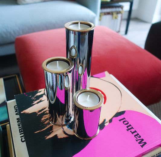 MCM Swedish chrome and brass candle holder set