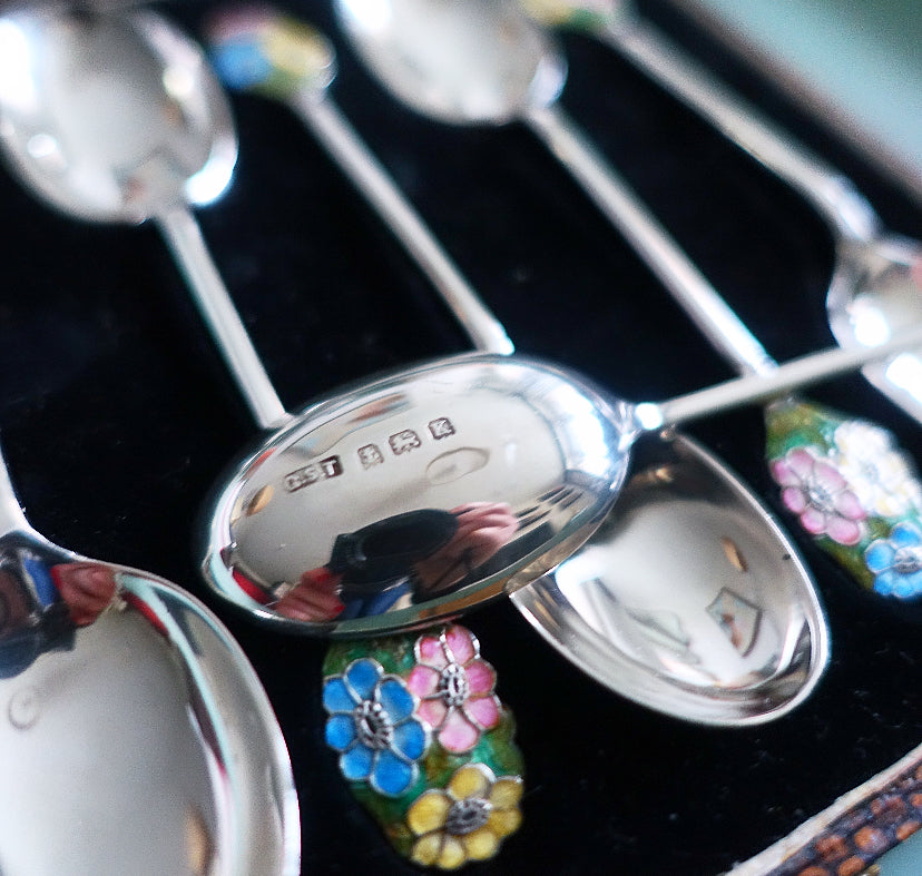 Set of six Art Deco silver hallmarked spoons with enamel floral finials