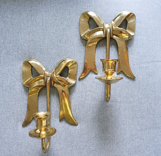 Pair of Hollywood Regency brass bow candle sconces