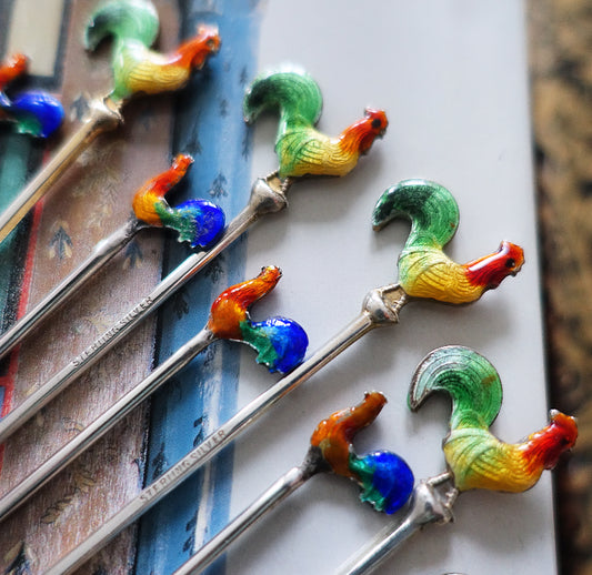 Set of 10 assorted silver and enamel cocktail sticks