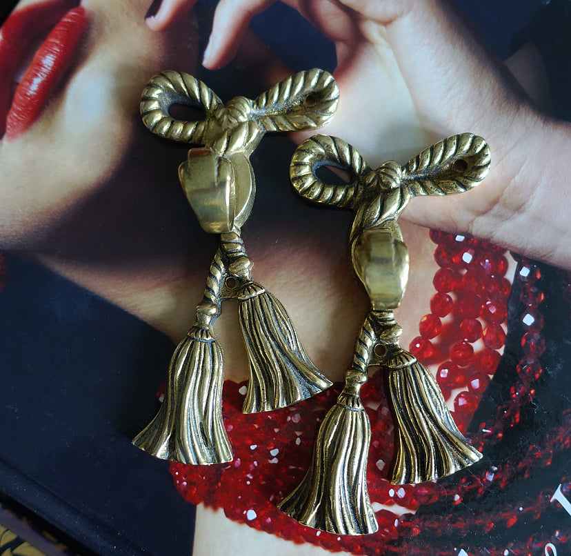 Pair of brass bow hooks